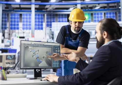 Solar panels plant engineering team talking, brainstorming ways to optimize efficiency after analyzing data. Photovoltaics factory colleagues work together on innovative solar cells design prototype